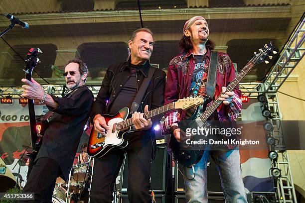 Musicians Mel Schacher, Max Carl, and Bruce Kulick of Grand Funk Railroad perform on stage at the San Diego County Fair on July 5, 2014 in Del Mar,...