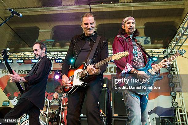 Musicians Mel Schacher, Max Carl, and Bruce Kulick of Grand Funk Railroad perform on stage at the San Diego County Fair on July 5, 2014 in Del Mar,...
