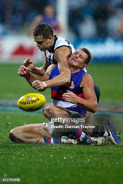 Jared Rivers of the Cats and Jack Redpath of the Bulldogs compete during the round 16 AFL match between the Geelong Cats and the Western Bulldogs at...