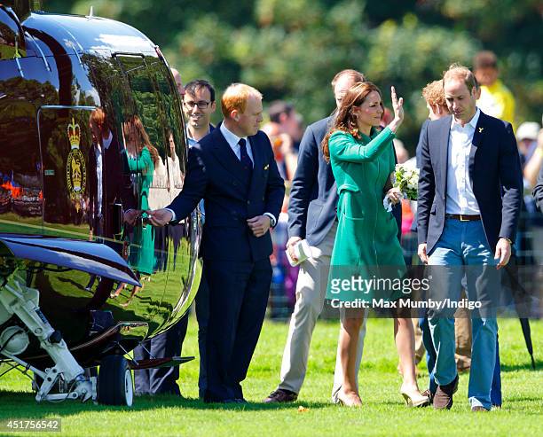 Catherine, Duchess of Cambridge and Prince William, Duke of Cambridge prepare to board a Sikorsky Helicopter as they leave Harewood House after...