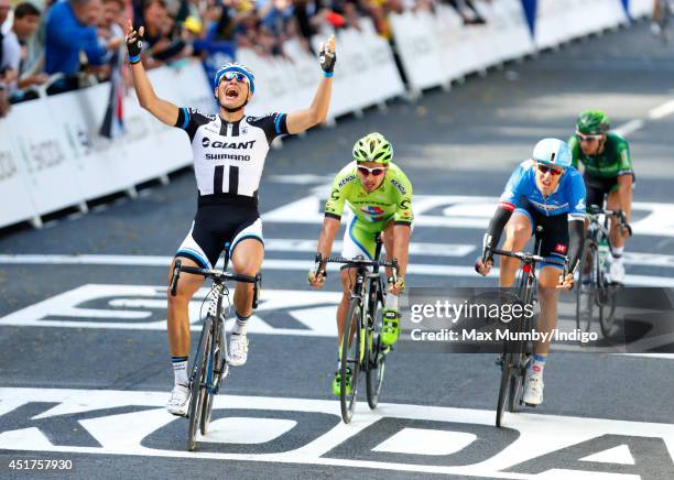 Marcel Kittel celebrates as he crosses the finish line to win stage one of the Tour de France on July 5, 2014 in Harrogate, England.