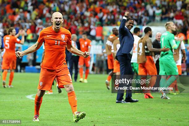 Arjen Robben of the Netherlands screams as he celebrates victory after the 2014 FIFA World Cup Brazil Quarter Final match between the Netherlands and...
