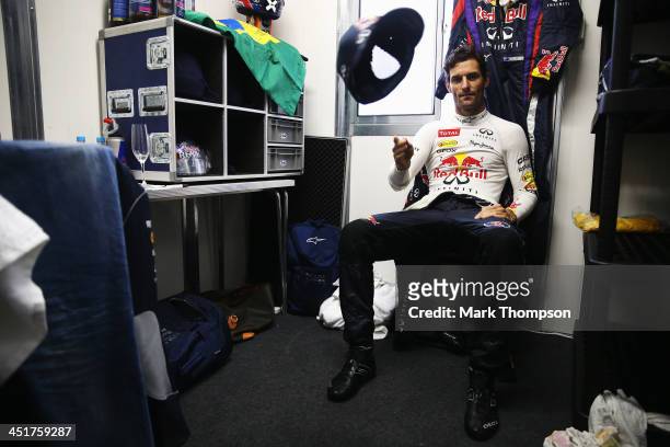 Mark Webber of Australia and Infiniti Red Bull Racing celebrates in his dressing room after finishing second in his final F1 race following the...