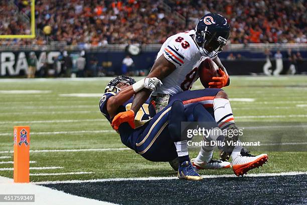 Martellus Bennett of the Chicago Bears scores a touchdown against T.J. McDonald of the St. Louis Rams at the Edward Jones Dome on November 24, 2013...