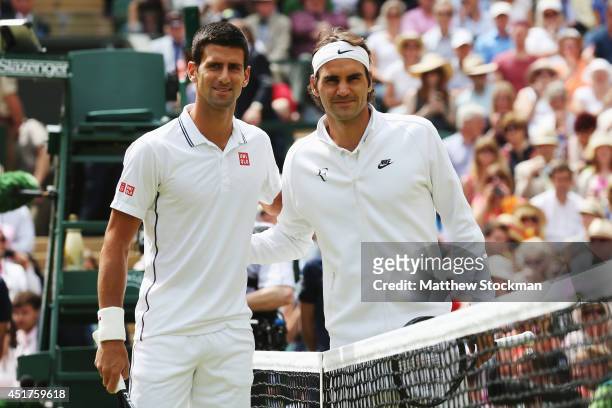 Novak Djokovic of Serbia and Roger Federer of Switzerland pose together before the Gentlemen's Singles Final match on day thirteen of the Wimbledon...