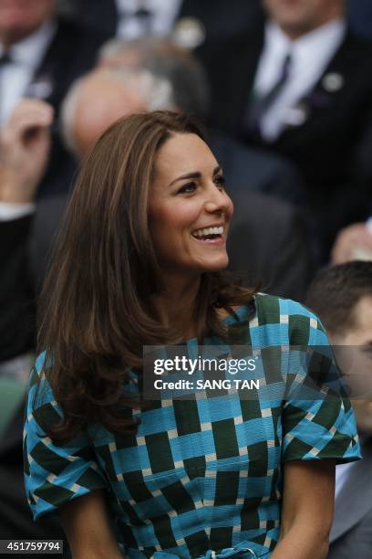 Britain's Catherine, Duchess of Cambridge, sits in the Royal Box on Centre Court before the start of the men's singles final match between Serbia's...