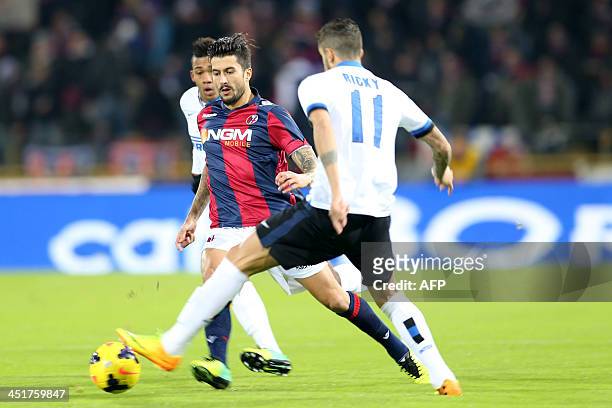 Bologna's midfielder Panagiotis Kone fights for the ball with Inter Milan's Argentinian midfielder Ricardo Gabriel Alvarez during their Serie A...