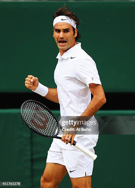 Roger Federer of Switzerland celebrates winning the opening set during the Gentlemen's Singles Final match against Novak Djokovic of Serbia on day...