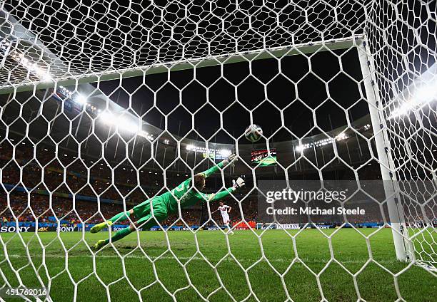 Christian Bolanos of Costa Rica scores a penalty past goalkeeper Tim Krul of the Netherlands in the shoot out during the 2014 FIFA World Cup Brazil...