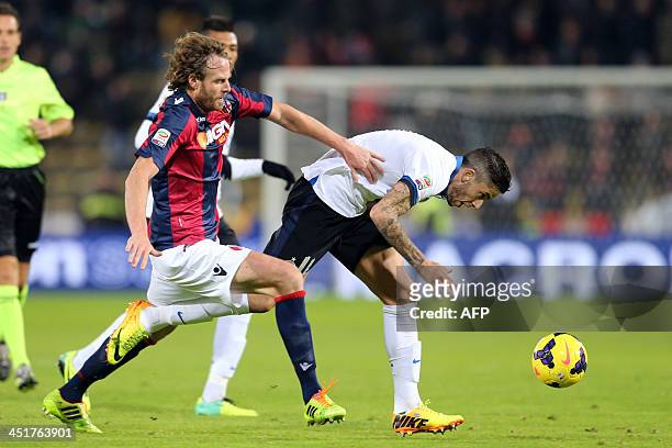 Bologna's defender Cesare Natali fights for the ball with Inter Milan's Argentinian midfielder Ricardo Gabriel Alvarez during their Serie A football...