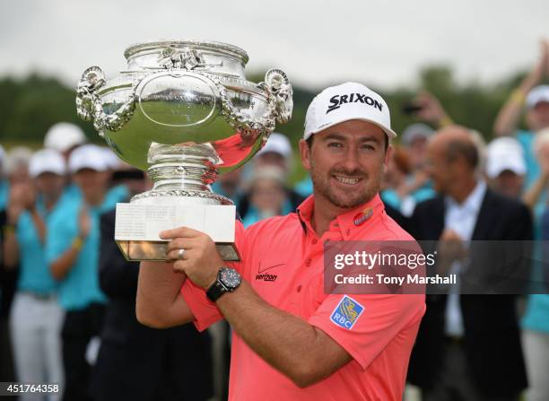 Graeme McDowell of Northern Ireland with the trophy after winning the Alstom Open de France - Day Four at Le Golf National on July 6, 2014 in Paris,...