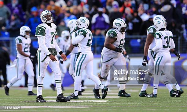 Quarterback Geno Smith of the New York Jets walks off the field after throwing an interception in the fourth quartrer of the Jets 19-3 loss to the...