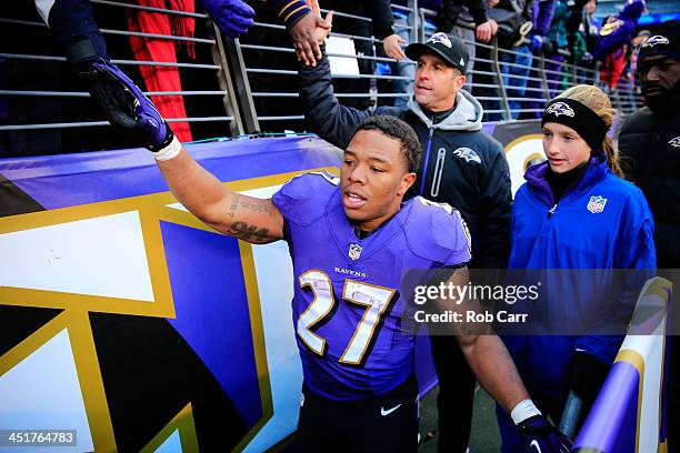 Ray Rice and head coach John Harbaugh of the Baltimore Ravens walk off the field with his daughter Alison following the Ravens 19-3 win over the New...