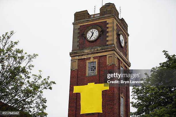 Large yellow jersey is seen hanging on the clock tower of the old Terry's chocolate factory at the start of the second stage of the 2014 Tour de...