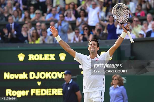 Serbia's Novak Djokovic celebrates winning his men's singles final match against Switzerland's Roger Federer on day thirteen of the 2014 Wimbledon...