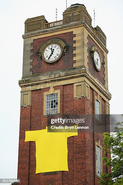 Large yellow jersey is seen hanging on the clock tower of the old Terry's chocolate factory at the start of the second stage of the 2014 Tour de...