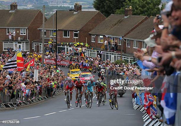 Riders make the climb of the Cote de Kenkins Road to the excitement of the fans during stage two of the 2014 Le Tour de France from York to Sheffield...