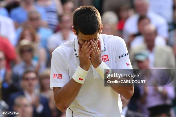 Serbia's Novak Djokovic celebrates winning his men's singles final match against Switzerland's Roger Federer on day thirteen of the 2014 Wimbledon...