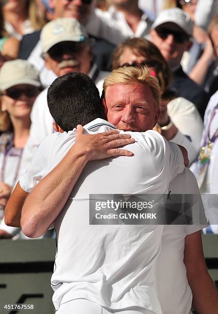 Serbia's Novak Djokovic hugs his coach, former tennis champion Boris Becker, as he celebrates winning his men's singles final match against...