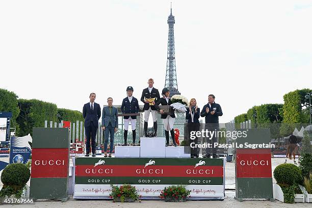 Robert Triefus , Charlotte Casiraghi , Virginie Couperie-Eiffel and Jan Tops pose with the Winners of the 'Gucci Gold Cup Paris Eiffel Jumping Table...