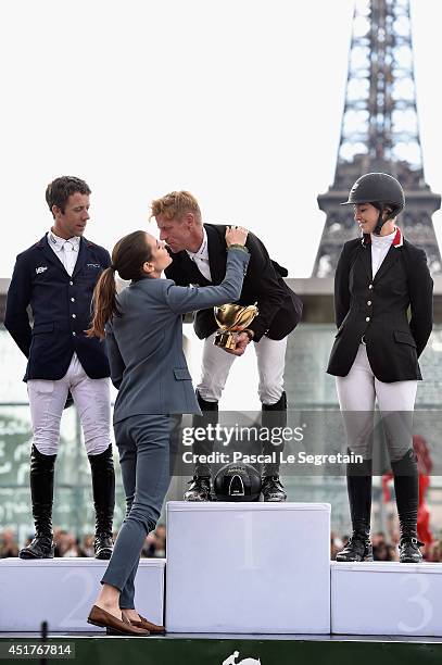 Charlotte Casiraghi congratulates the Winners of the 'Gucci Gold Cup Paris Eiffel Jumping Table A against the clock with jump-off ' Maikel van der...