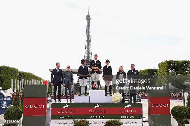 Robert Triefus , Charlotte Casiraghi , Virginie Couperie-Eiffel and Jan Tops pose with the Winners of the 'Gucci Gold Cup Paris Eiffel Jumping Table...