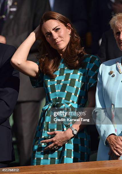 Catherine, Duchess of Cambridge attends the mens singles final between Novak Djokovic and Roger Federer on centre court during day thirteen of the...