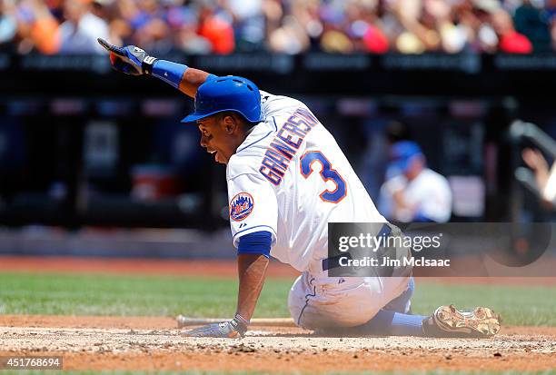 Curtis Granderson of the New York Mets reacts after scoring a first inning run against the Texas Rangers at Citi Field on July 6, 2014 in the...