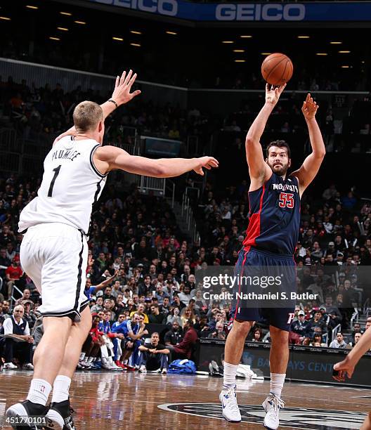 Josh Harrellson of the Detroit Pistons shoots during a game against the Brooklyn Nets at Barclays Center on November 24, 2013 in the Brooklyn borough...