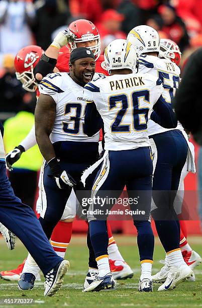 Fullback Le'Ron McClain of the San Diego Chargers celebrates with cornerback Johnny Patrick and inside linebacker Manti Te'o after the Chargers...
