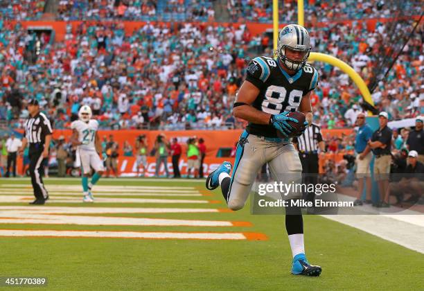 Greg Olsen of the Carolina Panthers catches a game winning touchdown during a game against the Miami Dolphins at Sun Life Stadium on November 24,...