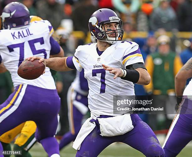 Christian Ponder of the Minnesota Vikings passes against the Green Bay Packers at Lambeau Field on November 24, 2013 in Green Bay, Wisconsin. The...