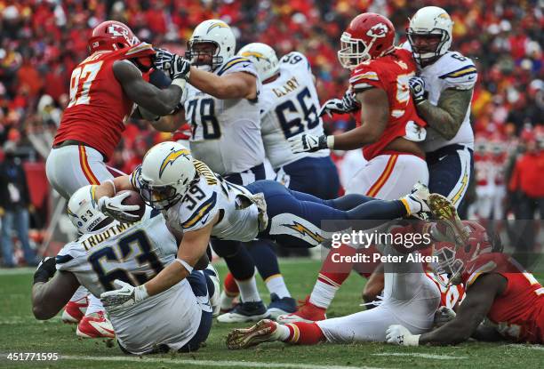 Running back Danny Woodhead of the San Diego Chargers dives over the goal line for a touchdown against the Kansas City Chiefs during the second half...