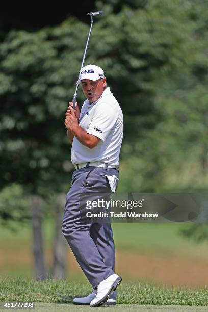 Angel Cabrera of Argentina reacts after a missed birdie putt on the sixth green during the final round of the Greenbrier Classic at the Old White TPC...