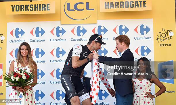 Prince Harry present Jens Voigt with the King of the Mountains jersey at the end of of Stage 1 of the Tour de France, on July 05, 2014 in Harrogate,...