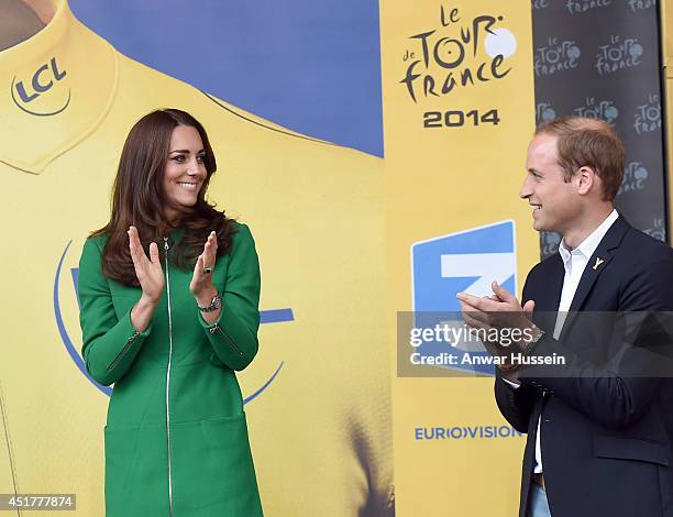 Prince William, Duke of Cambridge and Catherine, Duchess of Cambridge clap as they stand on the podium at the end of of Stage 1 of the Tour de...