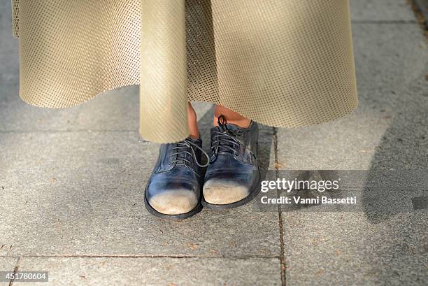 Elisa Carassai poses wearing a Samuji skirt and Officine Creative shoes before Atelier Versace show on July 6, 2014 in Paris, France.