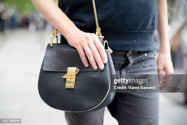 Fashion stylist Anya Ziourova poses wearing a Chlo bag after Atelier Versace show on July 6, 2014 in Paris, France.