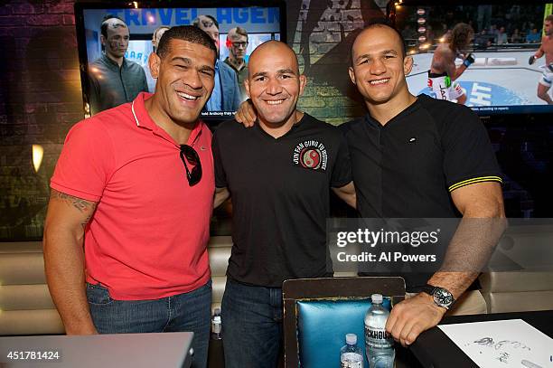 Mixed martial artists Antonio 'Bigfoot' Silva, Glover Texeira and Junior Dos Santos pose at the UFC Brazilian party during UFC International Fight...