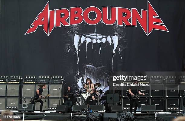 Justin Street, Joel O'Keeffe and David Roads of Airbourne perform at Day 3 of the Sonisphere Festival at Knebworth Park on July 6, 2014 in Knebworth,...