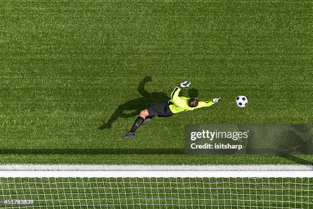 goal keeper in action - scoring a goal stock pictures, royalty-free photos & images