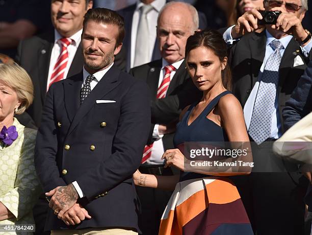 David Beckham and Victoria Beckham attend the mens singles final between Novak Djokovic and Roger Federer on centre court during day thirteen of the...