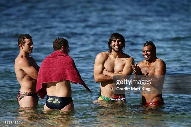 Bernard Foley Jacques Potgieter and Kurtley Beale take part in a Waratahs Super Rugby recovery session at Clovelly Beach on July 7, 2014 in Sydney,...