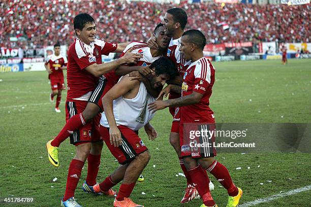 Roberto Tocker of Caracas FC and his teammates celebrate a goal against Deportivo Tachira during a match between Caracas FC and Deportivo Tachira as...