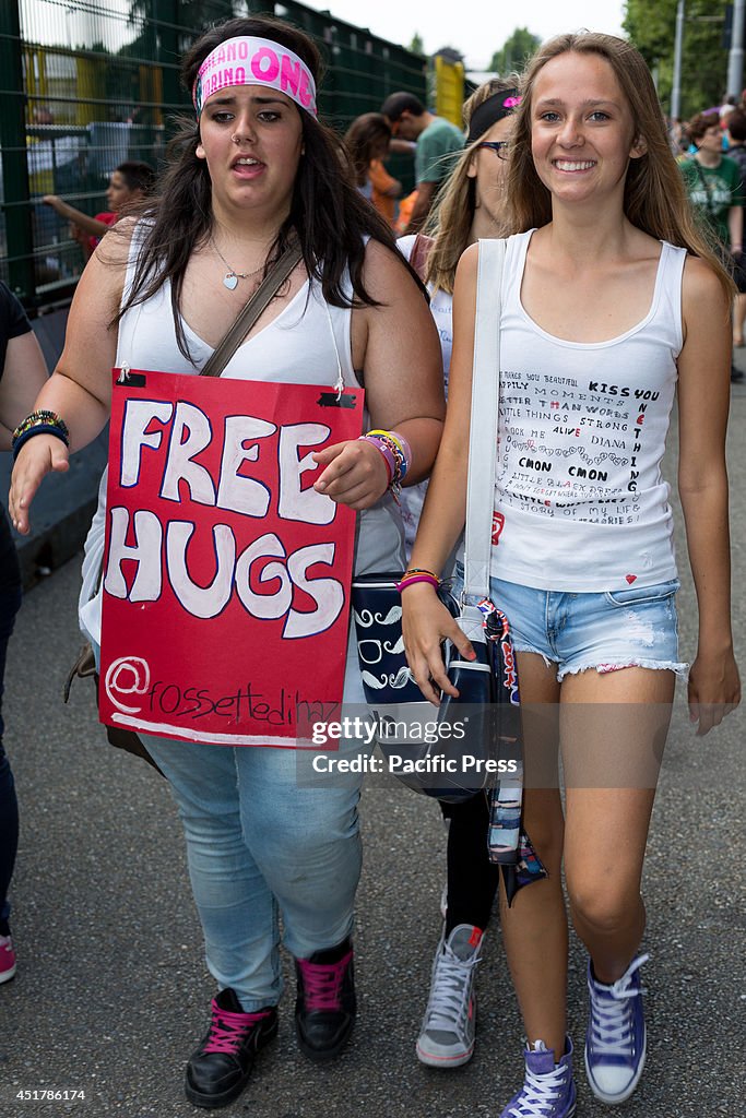 Fans of the popular boy band "One Direction" await the...