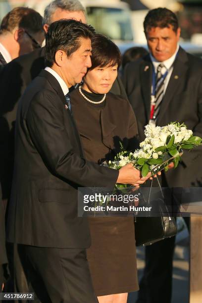 Japanese Prime Minister Shinzo Abe and his wife Akie Abe lay a wreath at the CTV site on July 7, 2014 in Christchurch, New Zealand. Prime Minister...