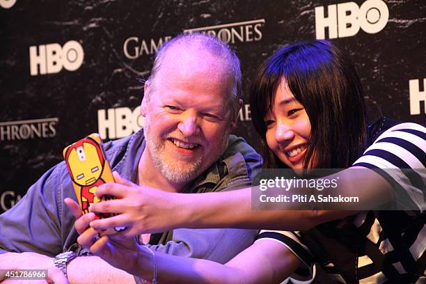 Game of Thrones fan taking picture with William Simpson, storyboard artist for the HBO series Game of Thrones at Bangkok Comic Con 2014. Bangkok...