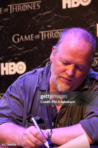 William Simpson, storyboard artist for the HBO series Game of Thrones, signing posters at Bangkok Comic Con 2014. Bangkok Comic Con is one of the...