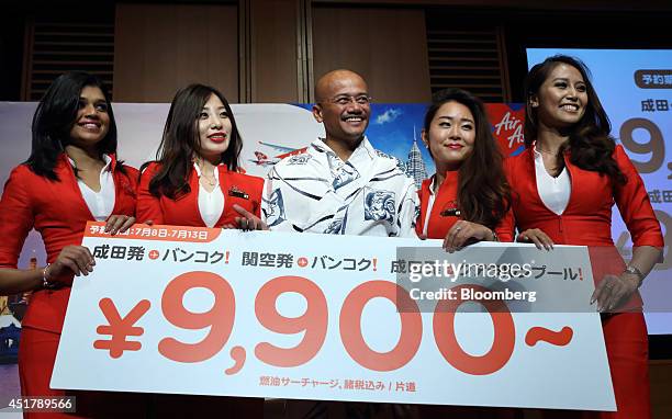 Usman Rkni Azran Osman-Rani, chief executive officer of AirAsia X Bhd., center ...