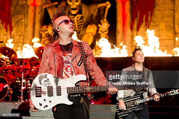 Bassist Johnny Christ and Guitarist Synyster Gates of Avenged Sevenfold perform at the main stage of Rockstar Energy Mayhem Festival on July 6, 2014...